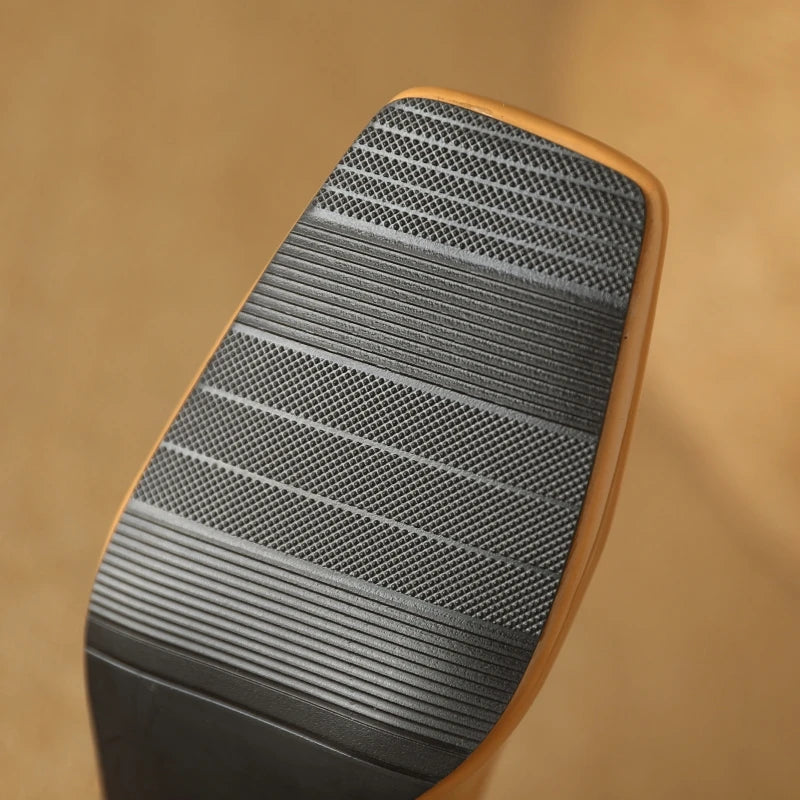 Apricot patent leather pumps, bottom view showing sole texture