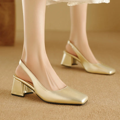 Apricot patent leather slingback pumps, worn by model standing