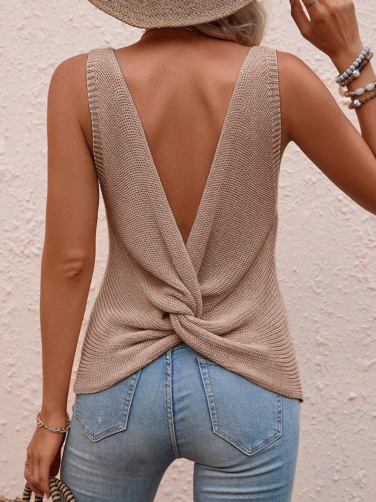 Back view of khaki twist-back sleeveless knit top showing draped twist design