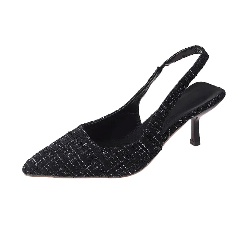 Black tweed slingback heels with adjustable strap, front angle
