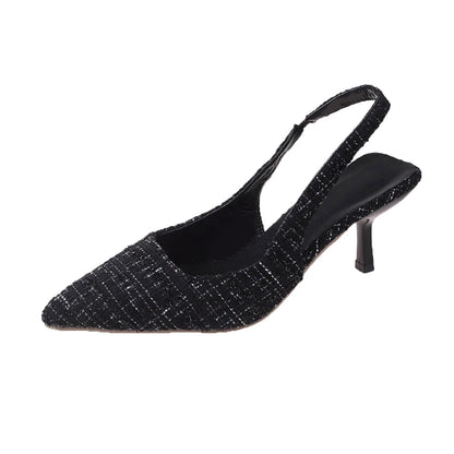 Black tweed slingback heels with adjustable strap, front angle