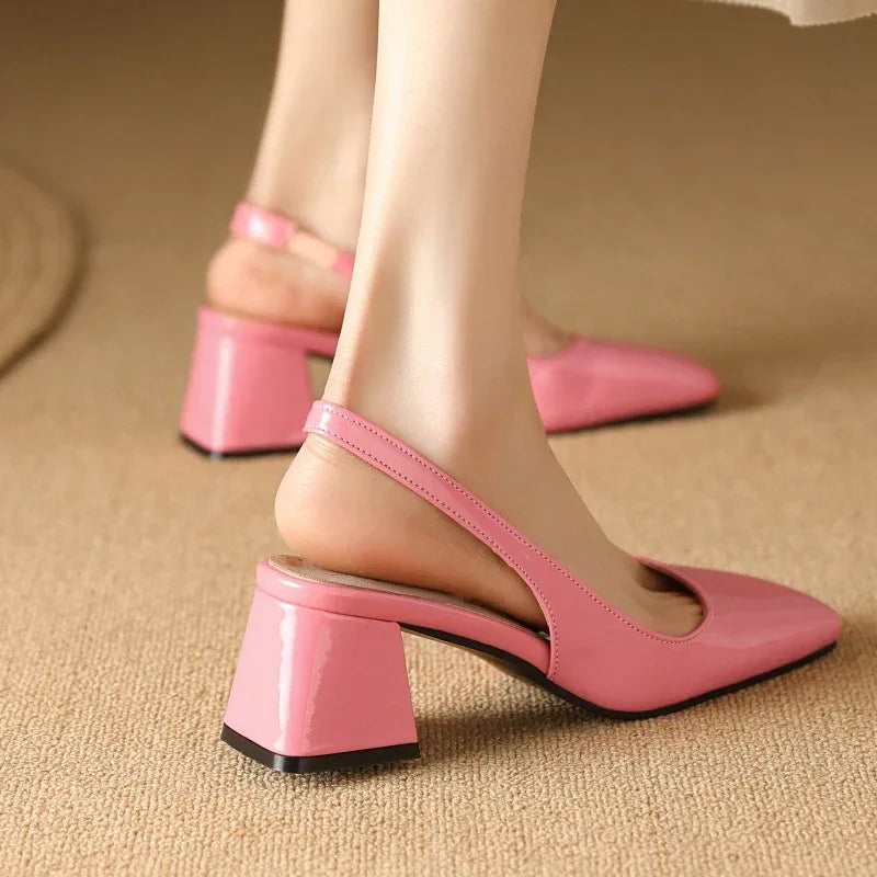 Pink patent leather slingback heels showing heel and strap design