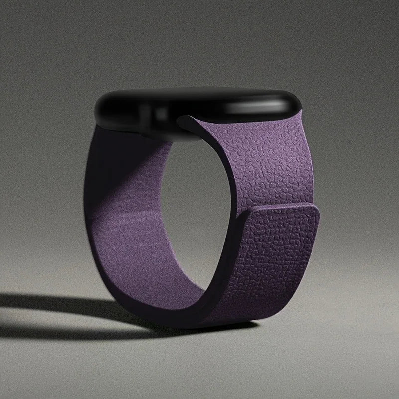 Purple magnetic leather loop Apple Watch band on grey background