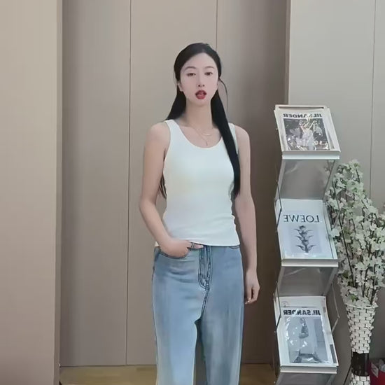 White ribbed tank top with chest support pads, casual layering style